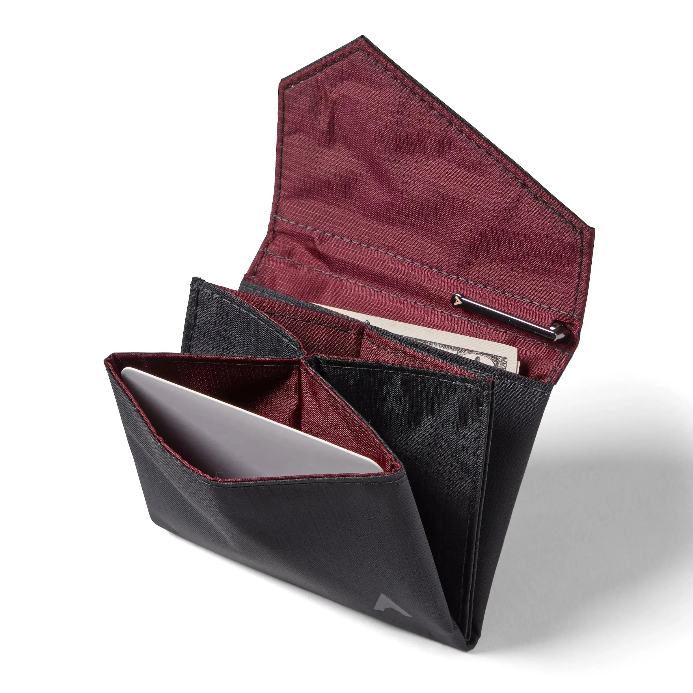 Open jet black nylon accordion wallet by Allett, with the flap opened to display multiple compartments for cards and money, and a special spot for a micro pen. Allett Accordion Wallet in RFID Blocking Nylon jet-black
