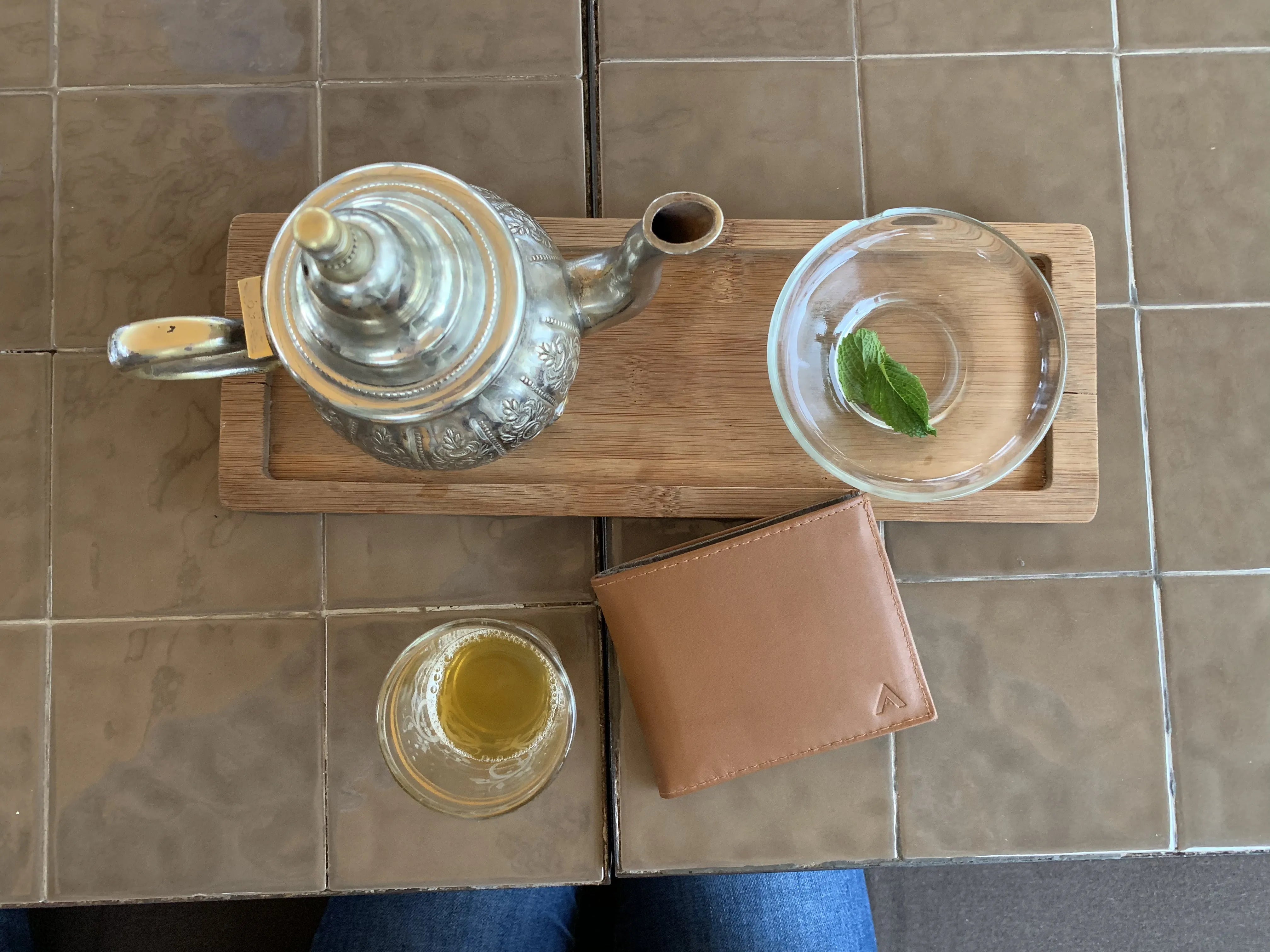 Lookout Wallet In Brown Next to Tea Set 