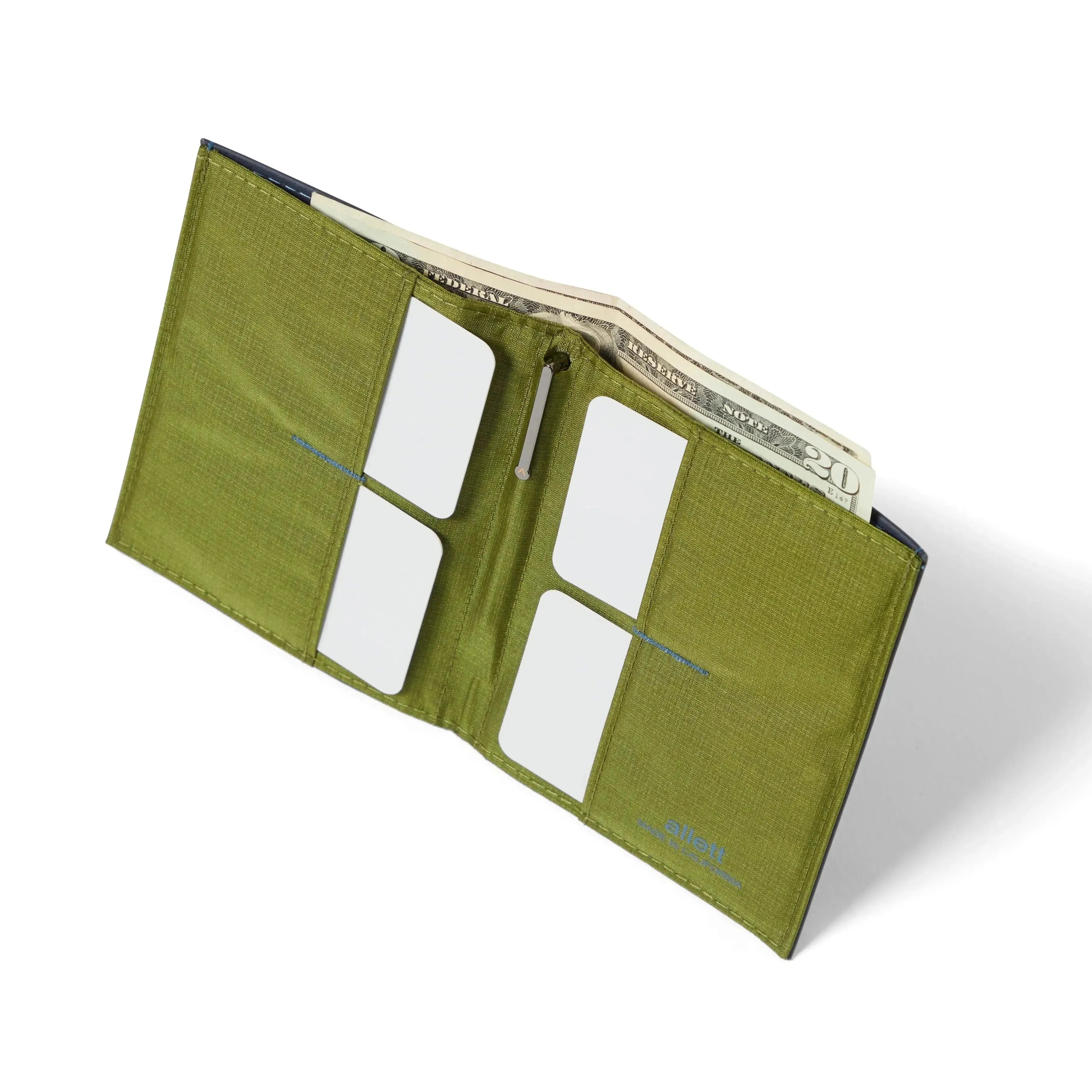 Vibrant green fabric interior of the midnight blue Nappa leather ultra slim wallet, showing 4 pockets for credit cards. Allett leather original wallet midnight-blue
