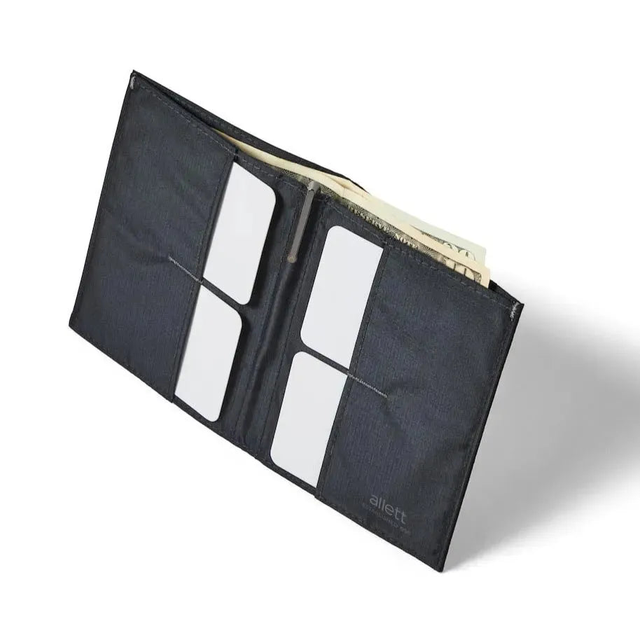Standing open jet black vegan coin wallet from Allett made with nylon, showing the 2 x 2 grid of credit card pockets. allett coin wallet jet-black