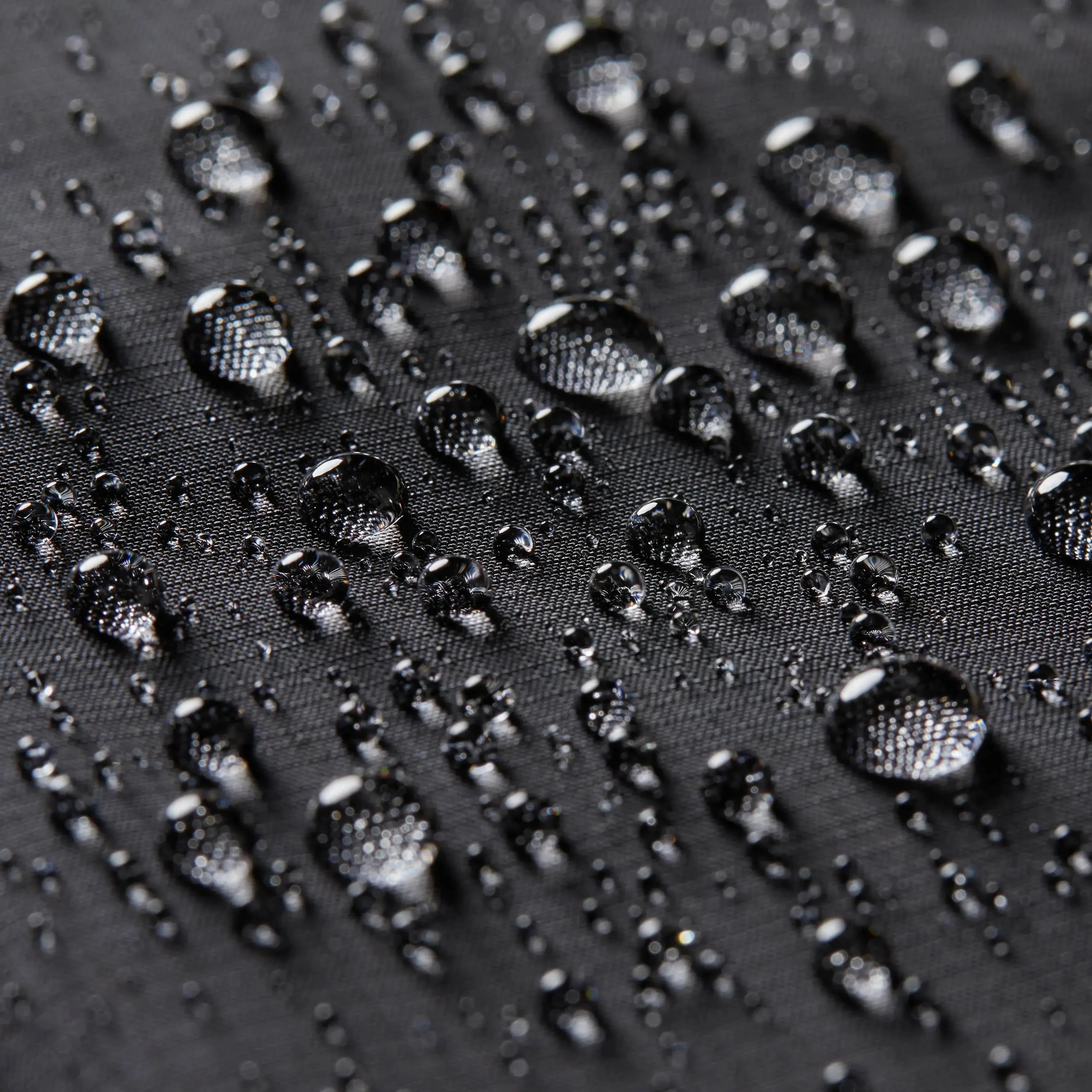 A close up of the Allett Wallet brand name on the vegan nylon wallet with RFID technology Jet-black